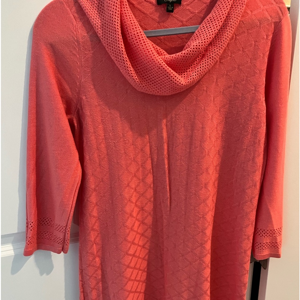 Soft knitted tunic. 3/4 sleeves and fringed hem.  Hand wash.